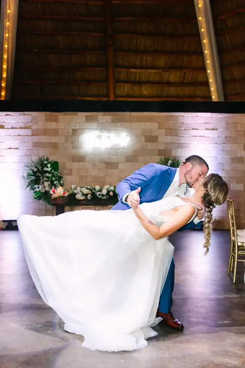 Couple first dance inside the barn