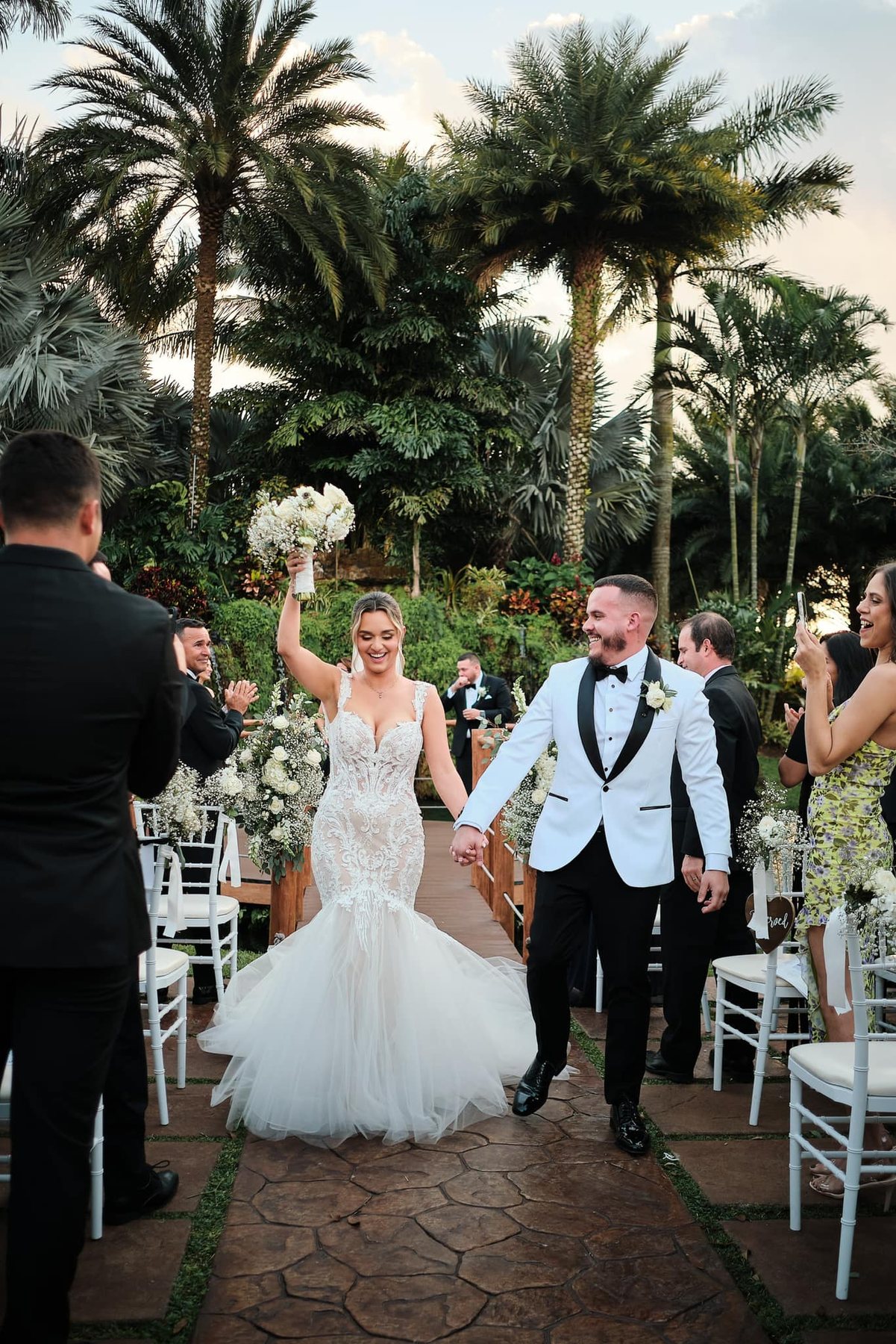 Bride and groom walking the ceremony aisle