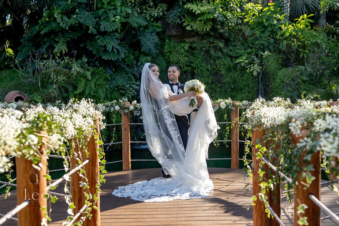 Bride posing on the Longan’s Place garden bridge