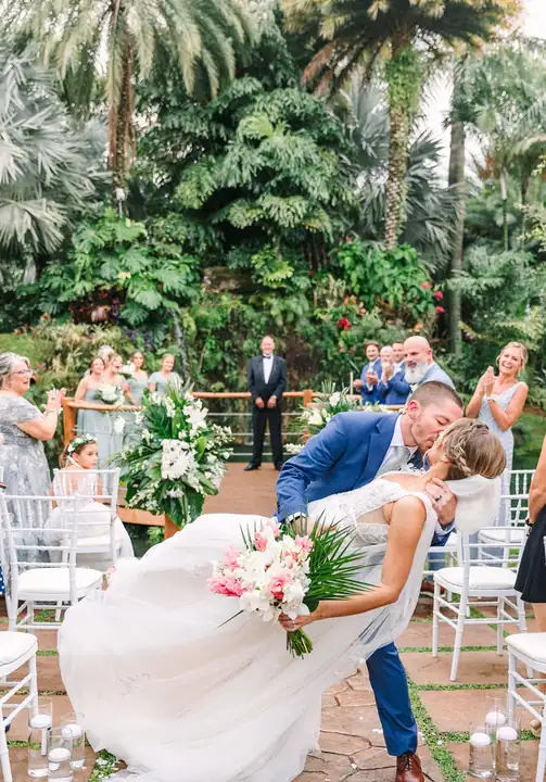 Guests watching an outdoor ceremony